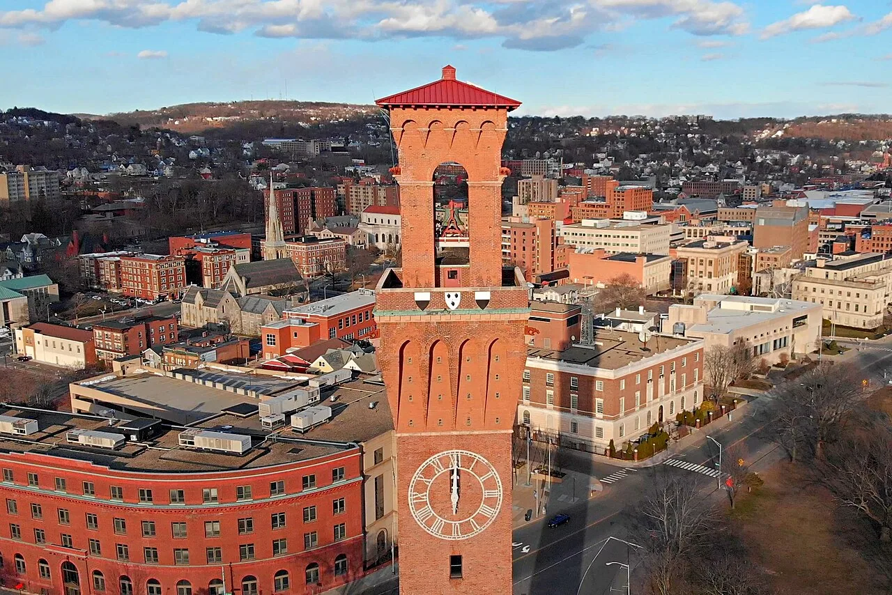 Brick clock tower and downtown buildings in Waterbury, Connecticut
